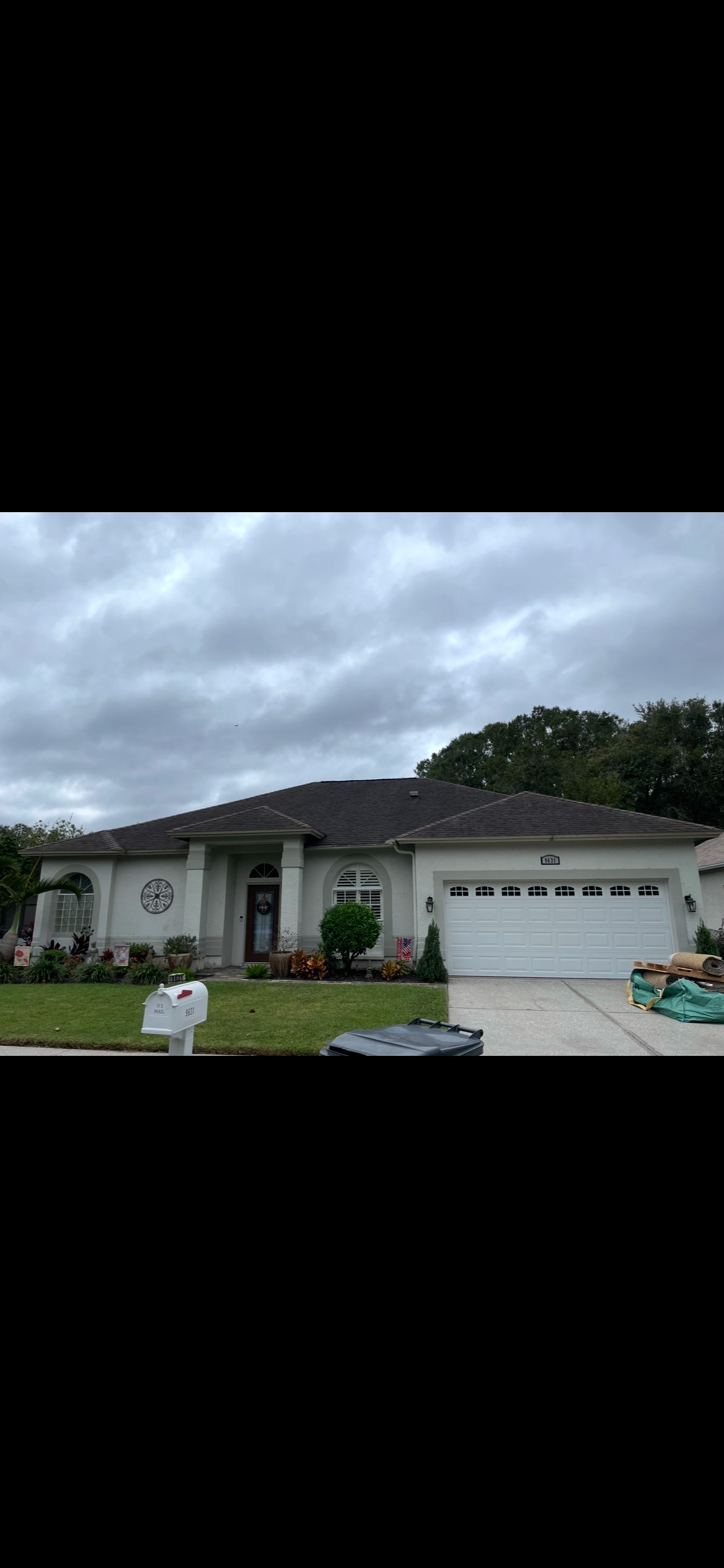Roof before soft wash cleaning in Trinity
