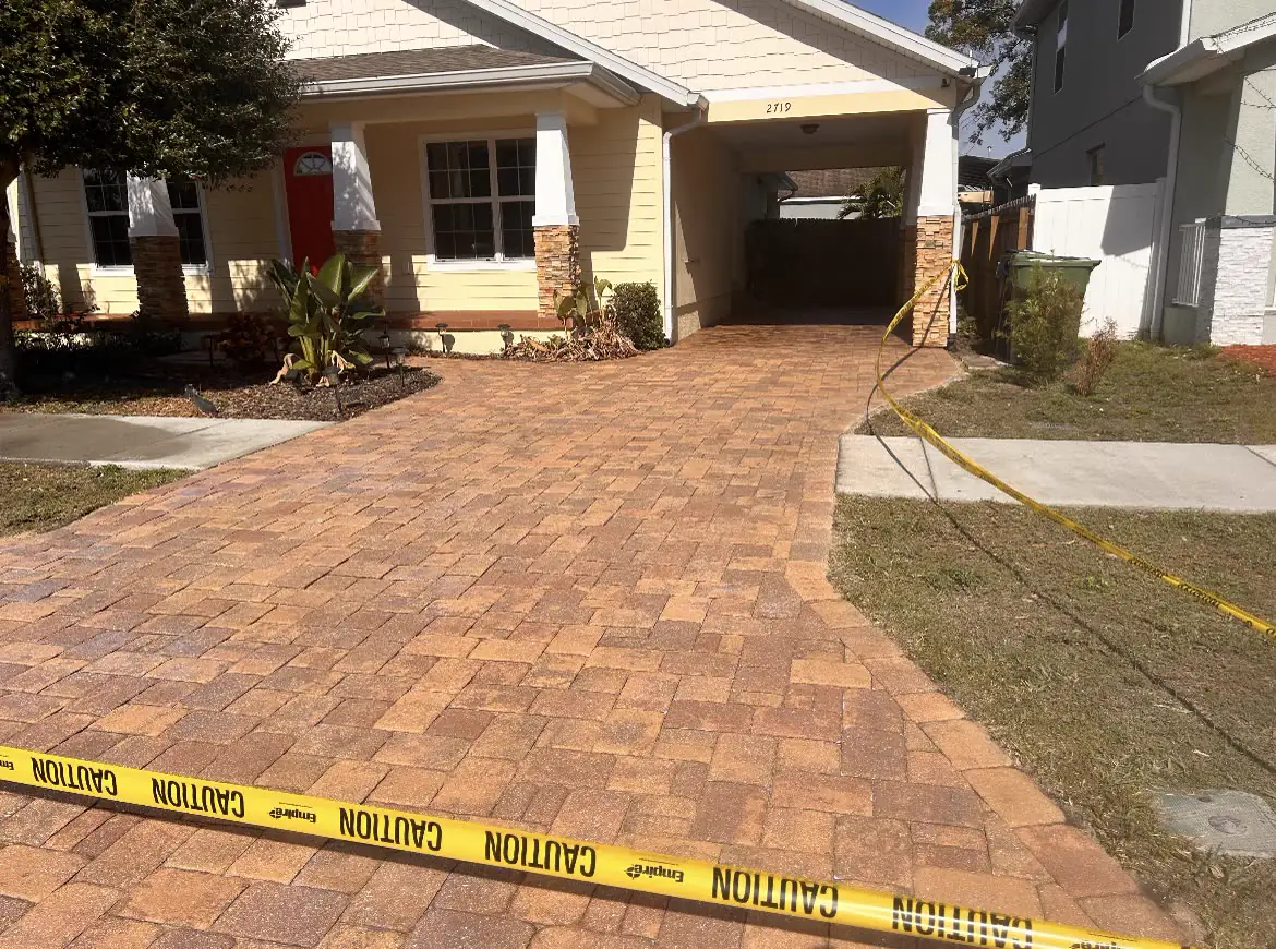 Richly-sealed brick paver driveway in front of a Tampa Bay home