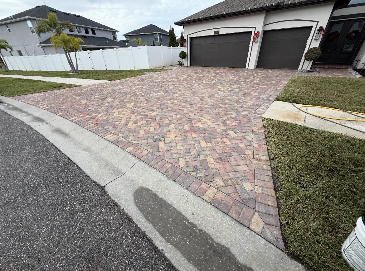 Richly-sealed brick paver driveway in front of a Tampa Bay home